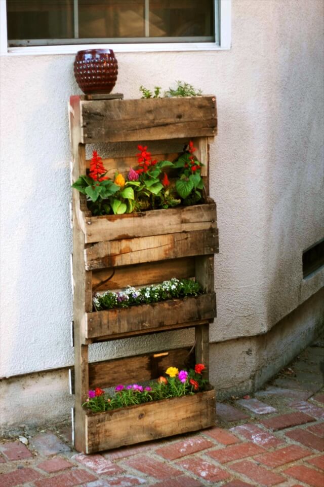 DIY A Gorgeous Garden Wall Using Dollar Tree Flower Pots And Wood Pallets