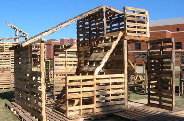  pallet shed at outdoor, the mounted bench on each pallet wall can