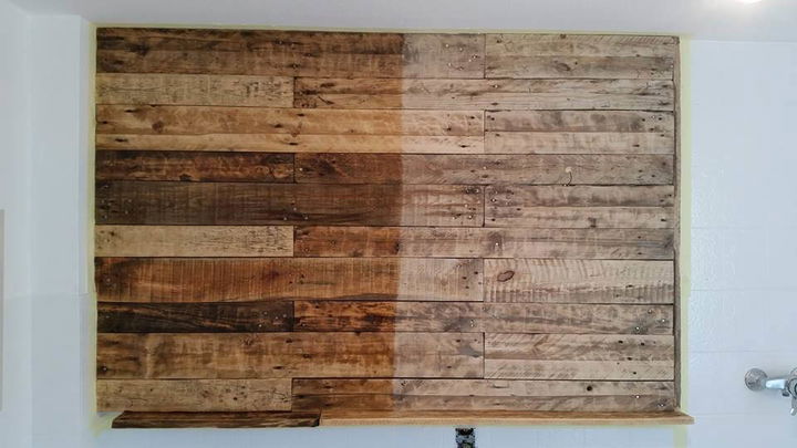 This is an unfinished preview of installed pallet wall, having a ...