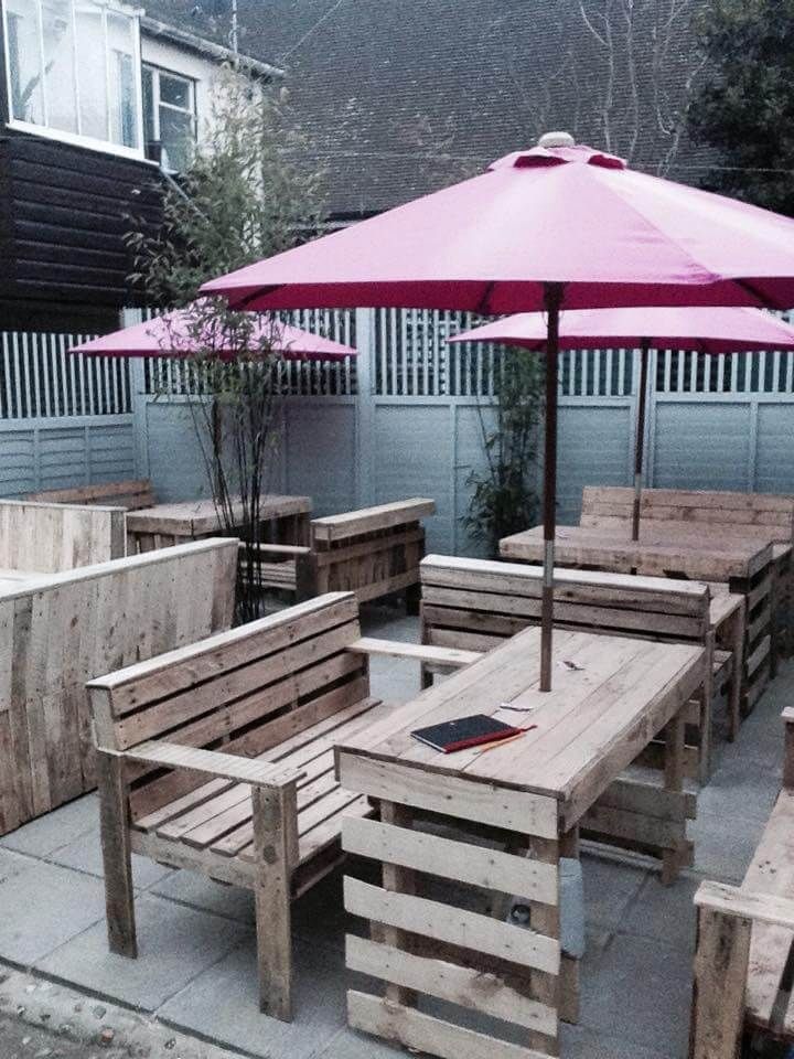 handmade pallet benches and table with umbrella
