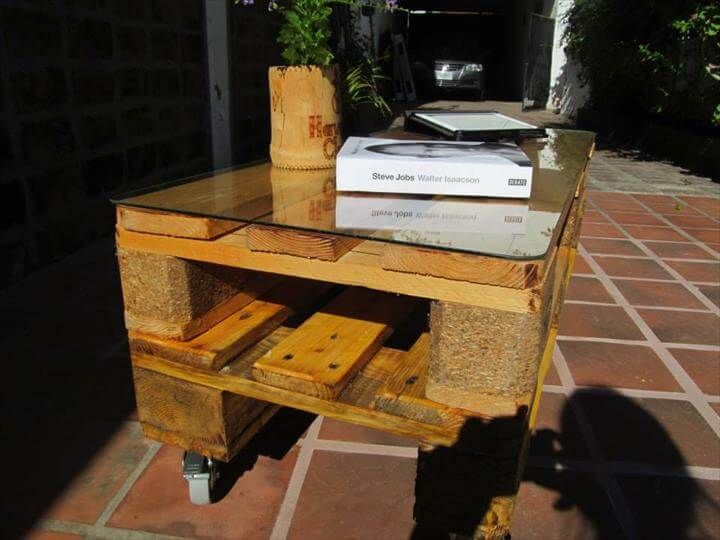 repurposed pallet coffee table with elegant glass top