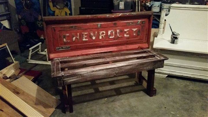 recycled pallet bench with old car part backrest