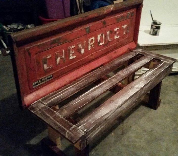 reclaimed pallet and metal patio bench
