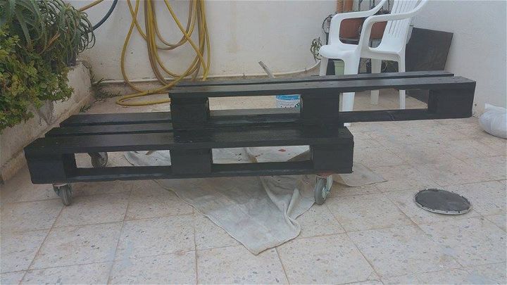 black stained pallet rolling console table