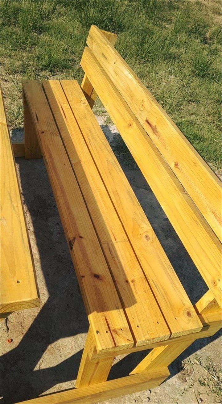 Yellow stained pallet picnic table with benches