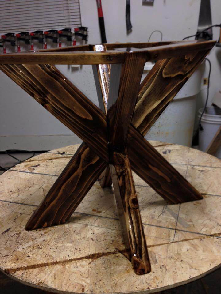 Wooden pallet dining table with X base