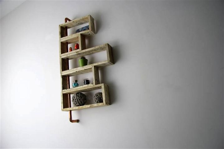recycled pallet and old metal pipe shelves