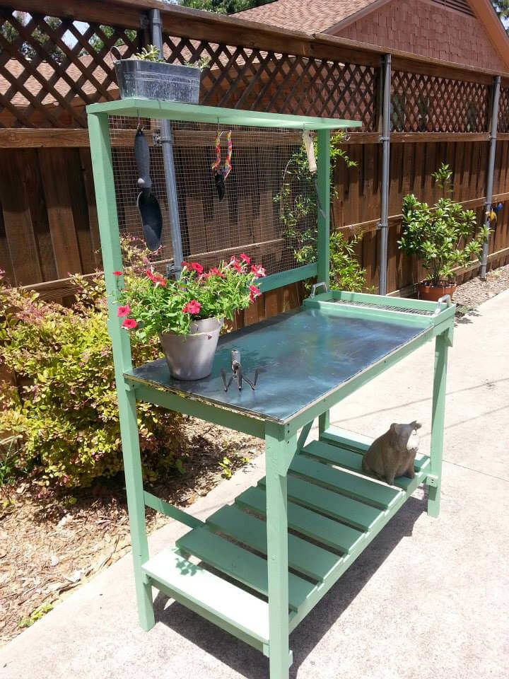 recycled pallet potting bench with galvanized zinc top