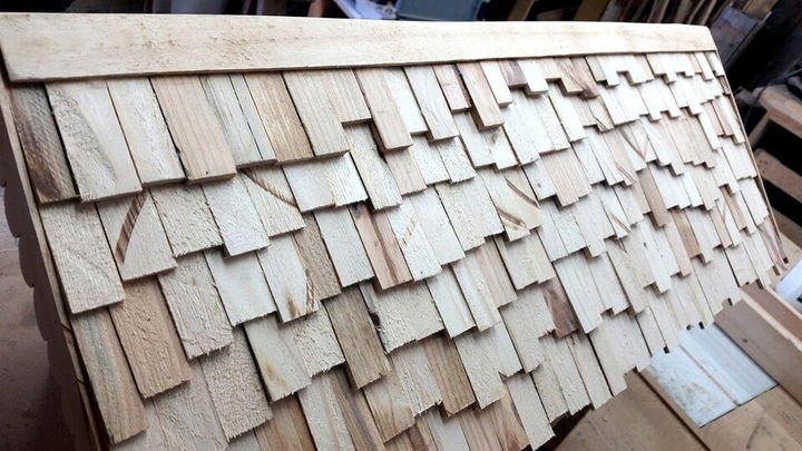 handcrafted wooden pallet mailbox having shingled roof