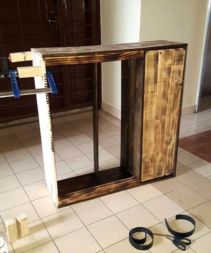 adding short wooden legs to bottom of cabinet