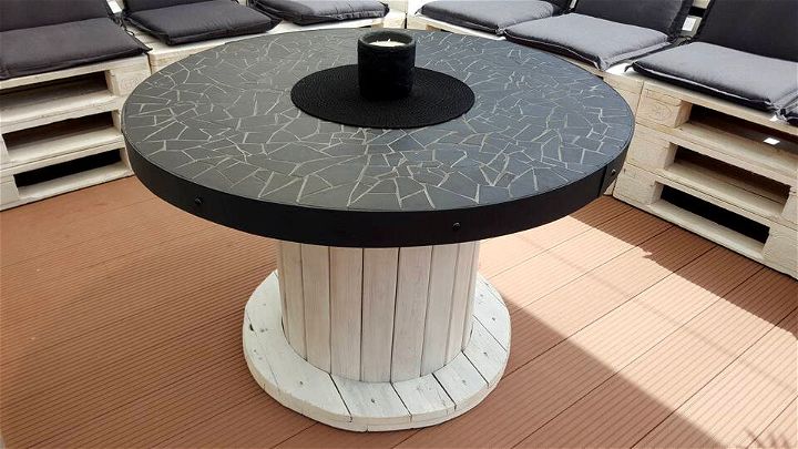 white and black old spool round coffee table