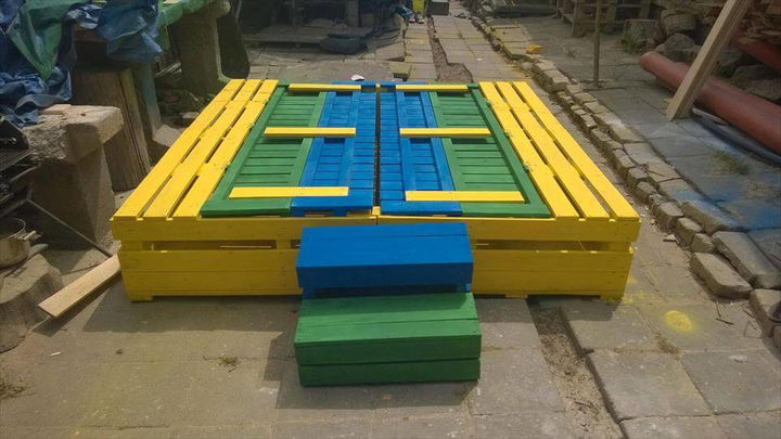 wooden pallet colorful sandbox with stair steps