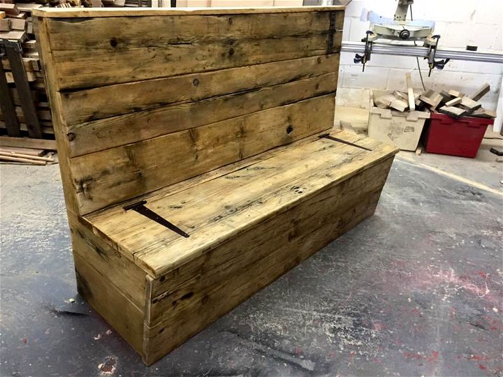 upcycled wooden pallet outdoor bench with secret stash